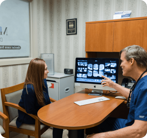 patient shaking hands with dentist